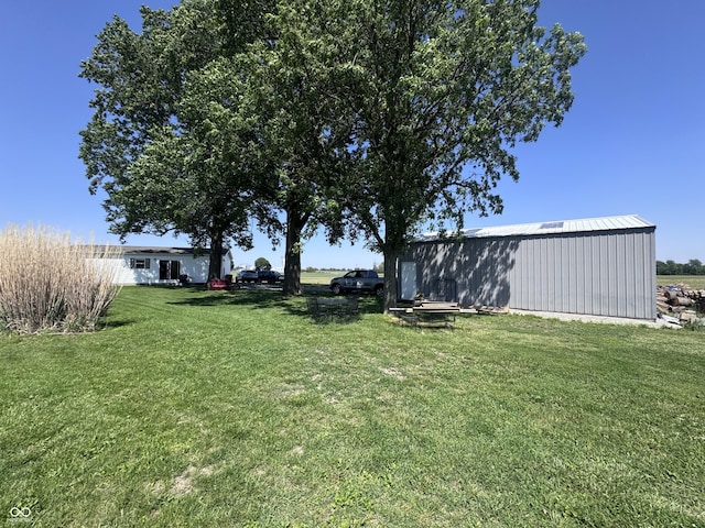 216 E Wabash St, Wingate, IN 47994 - view of grassy yard with an outbuilding and an outdoor structure
