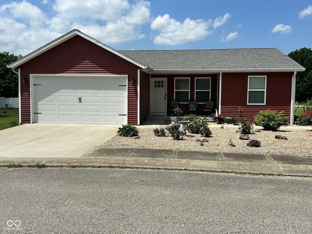 346 W N St, Gosport, IN 47433 - ranch-style house with a porch, a garage, concrete driveway, and a shingled roof