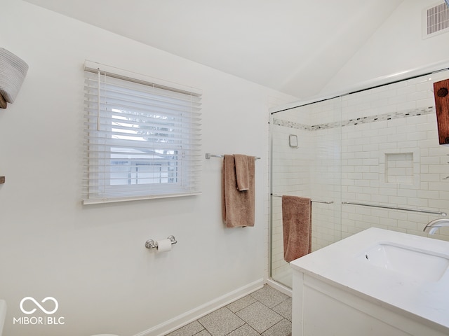3659 Watson Rd, Indianapolis, IN 46205 - bathroom with baseboards, a stall shower, vaulted ceiling, and vanity