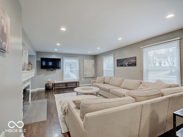 3659 Watson Rd, Indianapolis, IN 46205 - living room featuring wood finished floors, recessed lighting, a fireplace with flush hearth, and baseboards