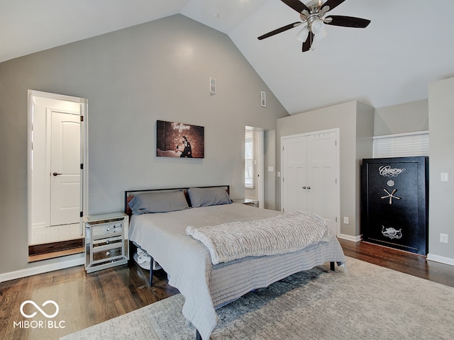 3659 Watson Rd, Indianapolis, IN 46205 - bedroom featuring high vaulted ceiling, wood finished floors, a closet, baseboards, and a ceiling fan