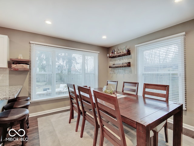 3659 Watson Rd, Indianapolis, IN 46205 - dining space featuring plenty of natural light, wood finished floors, baseboards, and recessed lighting