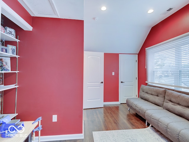 3659 Watson Rd, Indianapolis, IN 46205 - living area featuring wood finished floors, lofted ceiling, recessed lighting, baseboards, and attic access