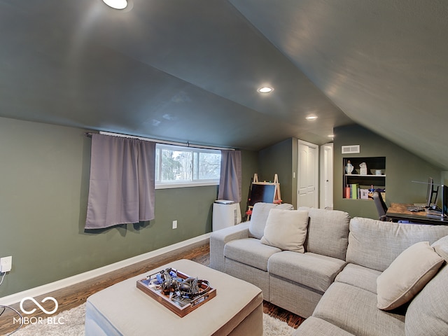3659 Watson Rd, Indianapolis, IN 46205 - living area with wood finished floors, lofted ceiling, baseboards, and recessed lighting