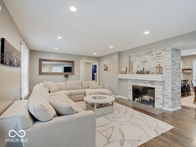 3659 Watson Rd, Indianapolis, IN 46205 - living area with wood finished floors, a fireplace, recessed lighting, and baseboards