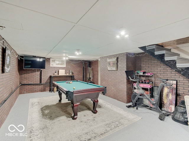 3659 Watson Rd, Indianapolis, IN 46205 - playroom with brick wall, billiards table, and concrete floors