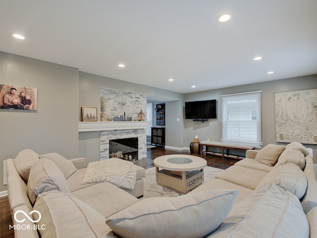 3659 Watson Rd, Indianapolis, IN 46205 - living area with wood finished floors, recessed lighting, baseboards, and a stone fireplace
