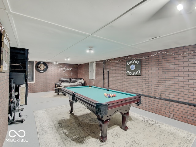 3659 Watson Rd, Indianapolis, IN 46205 - playroom featuring brick wall, pool table, and concrete flooring