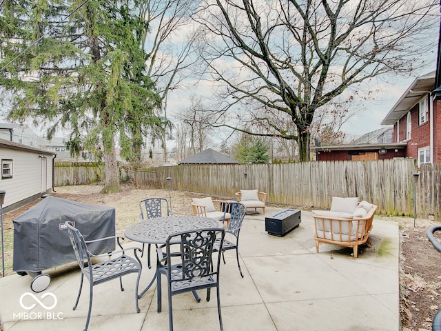 3659 Watson Rd, Indianapolis, IN 46205 - view of patio with grilling area, a fenced backyard, outdoor dining area, and an outdoor hangout area