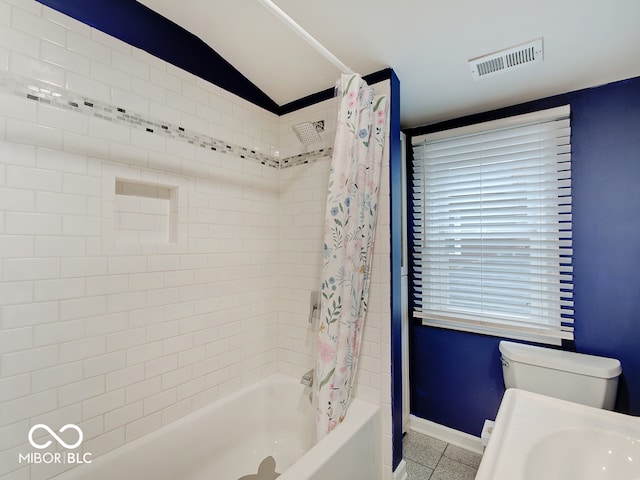 3659 Watson Rd, Indianapolis, IN 46205 - full bath with shower / tub combo, baseboards, tile patterned flooring, toilet, and a sink