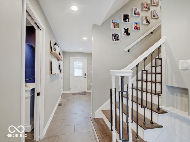 3659 Watson Rd, Indianapolis, IN 46205 - entryway with recessed lighting, stairs, baseboards, and tile patterned floors