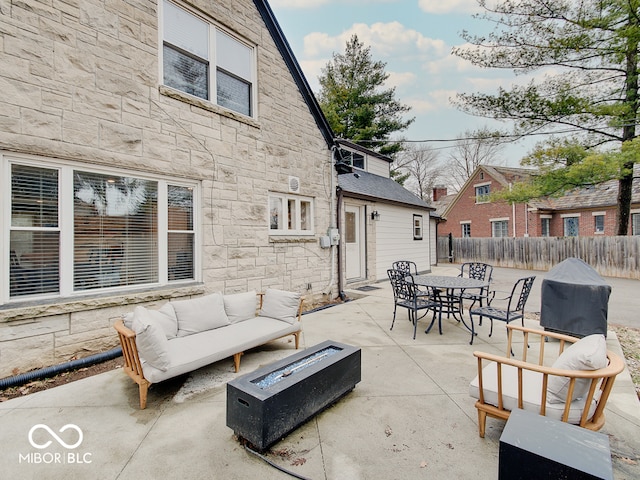 3659 Watson Rd, Indianapolis, IN 46205 - view of patio / terrace featuring an outdoor living space with a fire pit, outdoor dining space, and fence