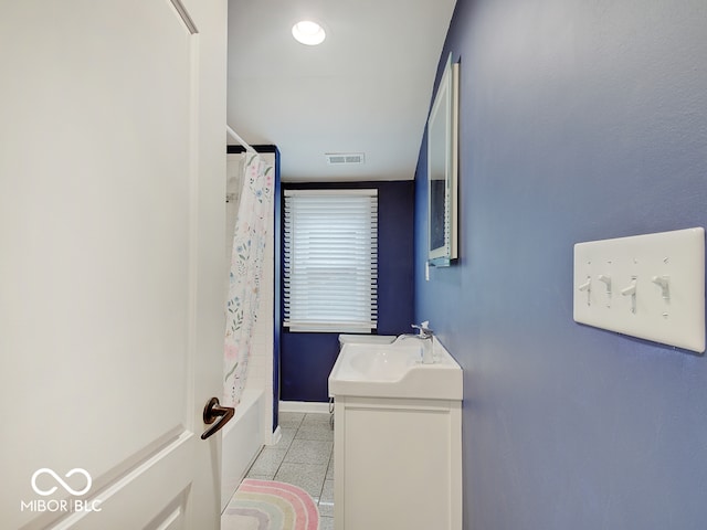 3659 Watson Rd, Indianapolis, IN 46205 - bathroom with baseboards, tile patterned floors, vanity, and shower / tub combo with curtain