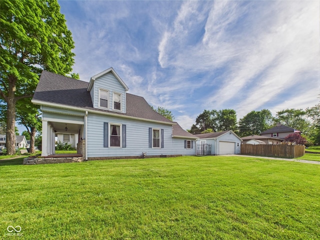 814 Walnut St, Anderson, IN 46012 - view of front of house featuring a detached garage, an outbuilding, and roof with shingles