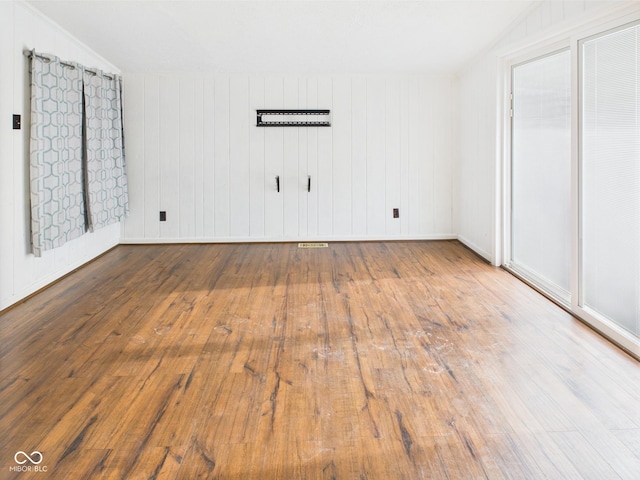 814 Walnut St, Anderson, IN 46012 - unfurnished bedroom featuring hardwood / wood-style floors