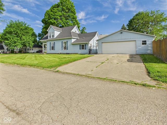 814 Walnut St, Anderson, IN 46012 - view of front of house with an outbuilding, a garage, and a shingled roof