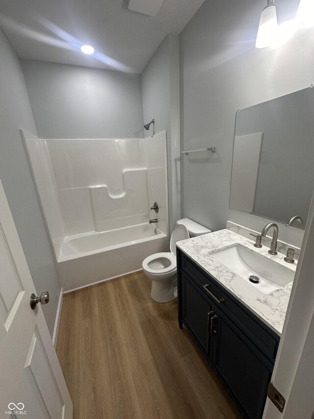 223 N Coventry Dr, Anderson, IN 46012 - full bathroom with toilet, vanity, wood finished floors, and bathtub / shower combination
