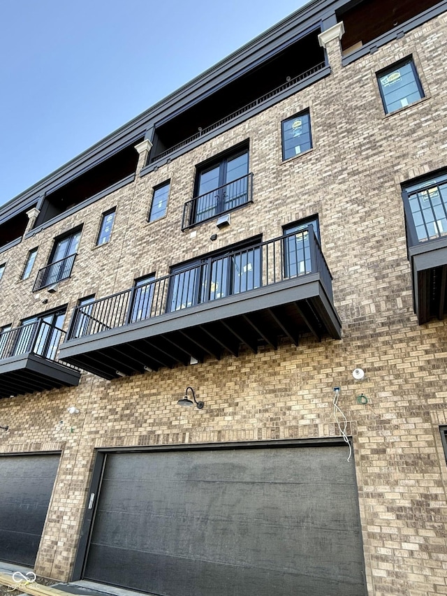 120 First Ave SE, Carmel, IN 46032 - view of apartment building / complex featuring an attached garage