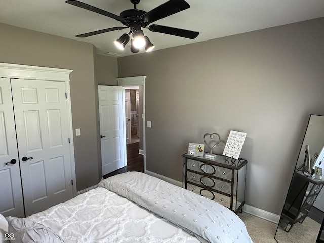 bedroom featuring baseboards, a closet, and ceiling fan