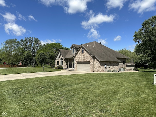 craftsman-style house featuring concrete driveway, a front lawn, stone siding, and a garage