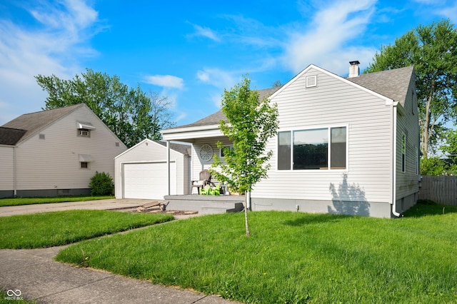 view of front of home with an outdoor structure, a chimney, driveway, and roof with shingles