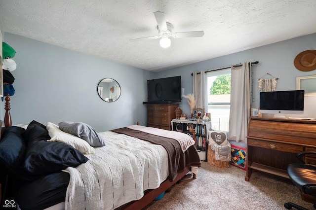 carpeted bedroom with a textured ceiling and ceiling fan