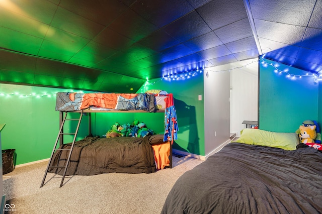 bedroom featuring carpet floors and baseboards