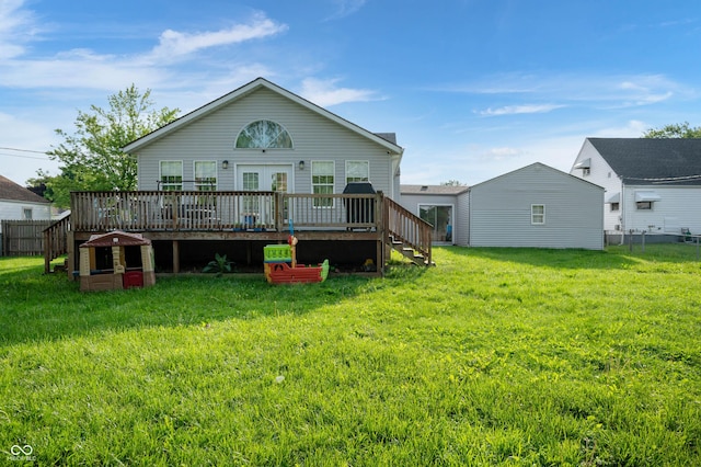 rear view of house featuring a wooden deck