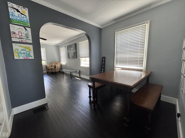 144 S 7th Ave, Beech Grove, IN 46107 - dining area with arched walkways, baseboards, ornamental molding, and wood-type flooring