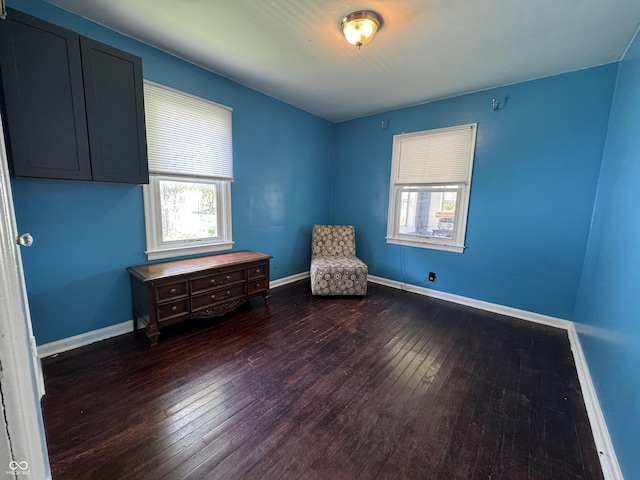 144 S 7th Ave, Beech Grove, IN 46107 - unfurnished room featuring dark wood finished floors, healthy amount of natural light, and baseboards