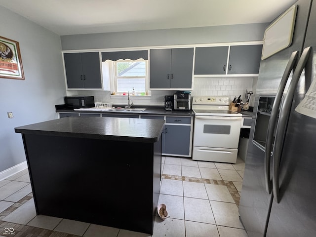 144 S 7th Ave, Beech Grove, IN 46107 - kitchen with stainless steel refrigerator with ice dispenser, white electric stove, a sink, dark countertops, and light tile patterned flooring