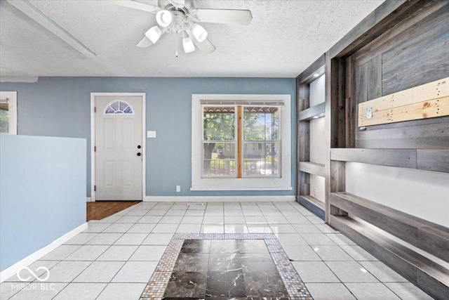 1170 N Concord St, Indianapolis, IN 46222 - tiled entryway featuring a textured ceiling, baseboards, and ceiling fan