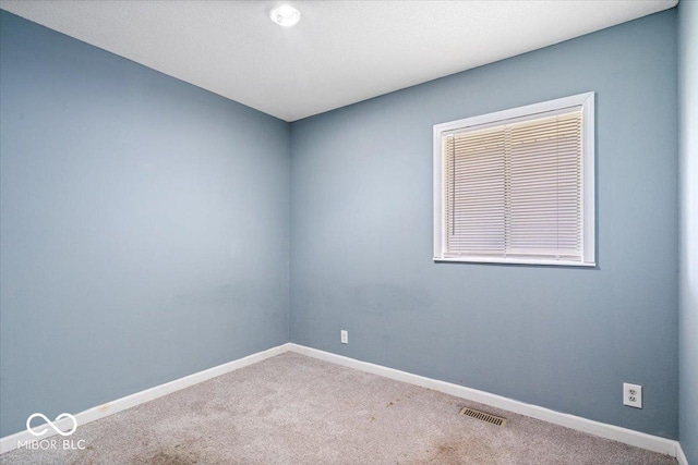 1170 N Concord St, Indianapolis, IN 46222 - carpeted empty room featuring baseboards
