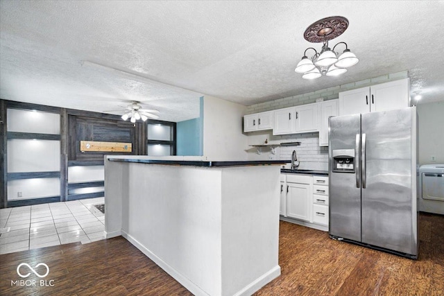 1170 N Concord St, Indianapolis, IN 46222 - kitchen with stainless steel refrigerator with ice dispenser, washer / dryer, dark countertops, a sink, and ceiling fan