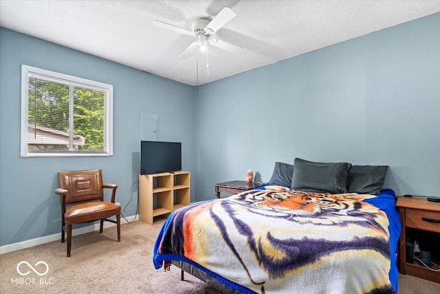 1170 N Concord St, Indianapolis, IN 46222 - bedroom with light colored carpet, a ceiling fan, a textured ceiling, and baseboards