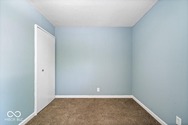 1170 N Concord St, Indianapolis, IN 46222 - unfurnished room featuring carpet flooring, a textured ceiling, and baseboards