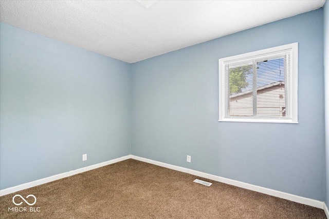 1170 N Concord St, Indianapolis, IN 46222 - unfurnished room featuring dark carpet and baseboards