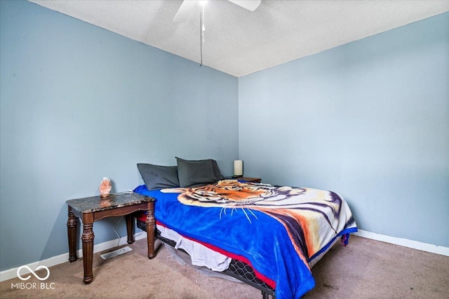 1170 N Concord St, Indianapolis, IN 46222 - carpeted bedroom featuring baseboards, ceiling fan, and a textured ceiling