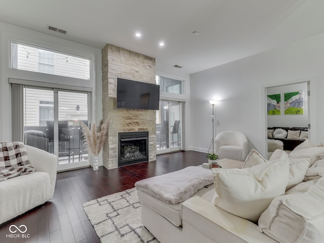 222 N E St Unit 103, Indianapolis, IN 46204 - living area featuring a fireplace, dark wood-style floors, and healthy amount of natural light