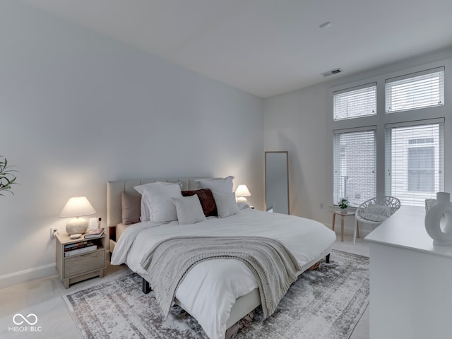 222 N E St Unit 103, Indianapolis, IN 46204 - bedroom with light colored carpet and baseboards