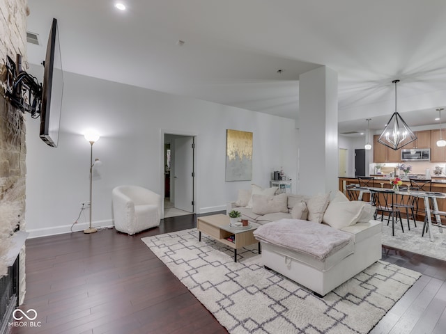 222 N E St Unit 103, Indianapolis, IN 46204 - living room with dark wood-style floors, a chandelier, baseboards, and recessed lighting