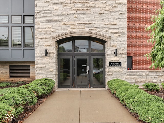 222 N E St Unit 103, Indianapolis, IN 46204 - view of exterior entry featuring stone siding