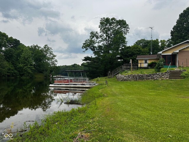 7114 Locust Lake W Dr, Spencer, IN 47460 - view of green lawn featuring a water view and a boat dock