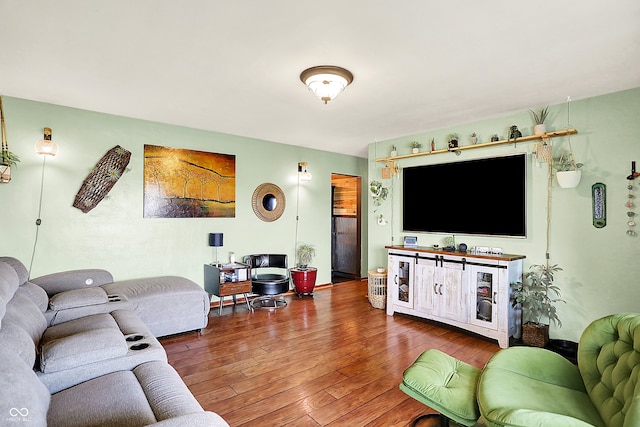 living area with hardwood / wood-style flooring