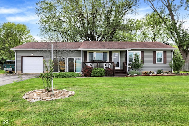ranch-style home with a garage, driveway, a porch, and a front lawn