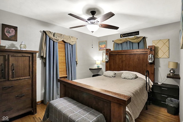 bedroom with wood finished floors and a ceiling fan
