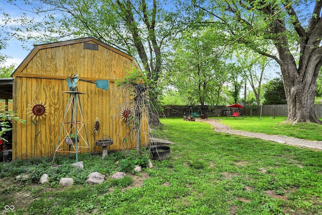 view of yard featuring an outbuilding and a storage shed