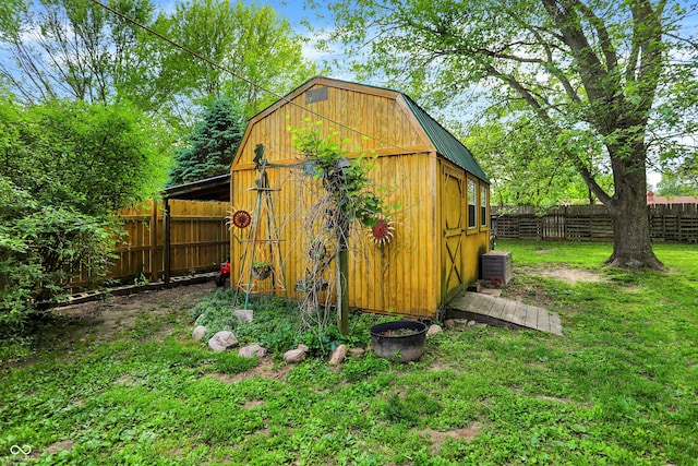 view of outbuilding with central AC and an outdoor structure