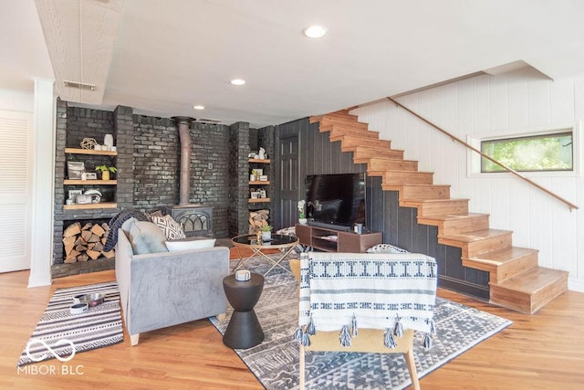 5078 Evergreen Ln, Gosport, IN 47433 - living room featuring a wood stove, wood finished floors, stairway, and recessed lighting