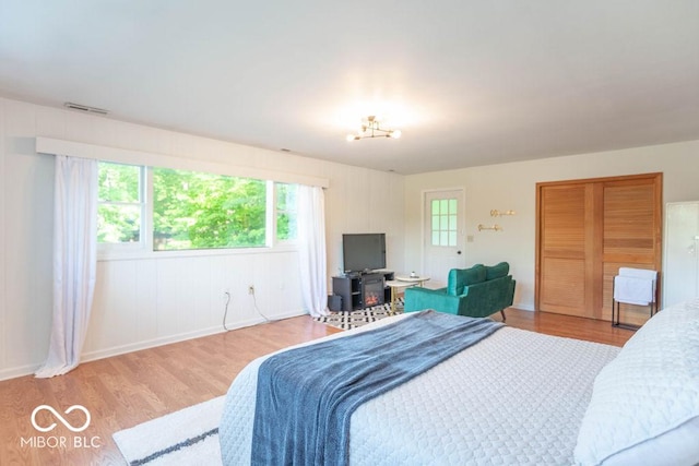 5078 Evergreen Ln, Gosport, IN 47433 - bedroom with wood finished floors, baseboards, and a chandelier